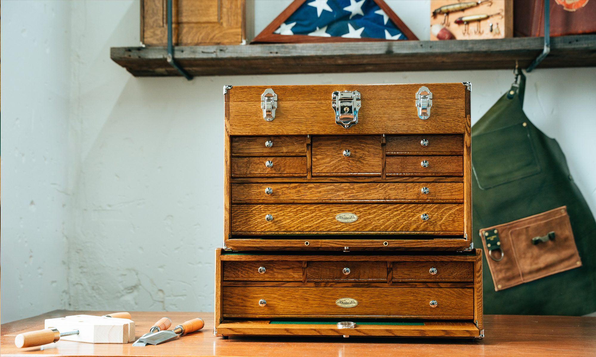 wood tool chest and base on a table with American flag on a shelf
