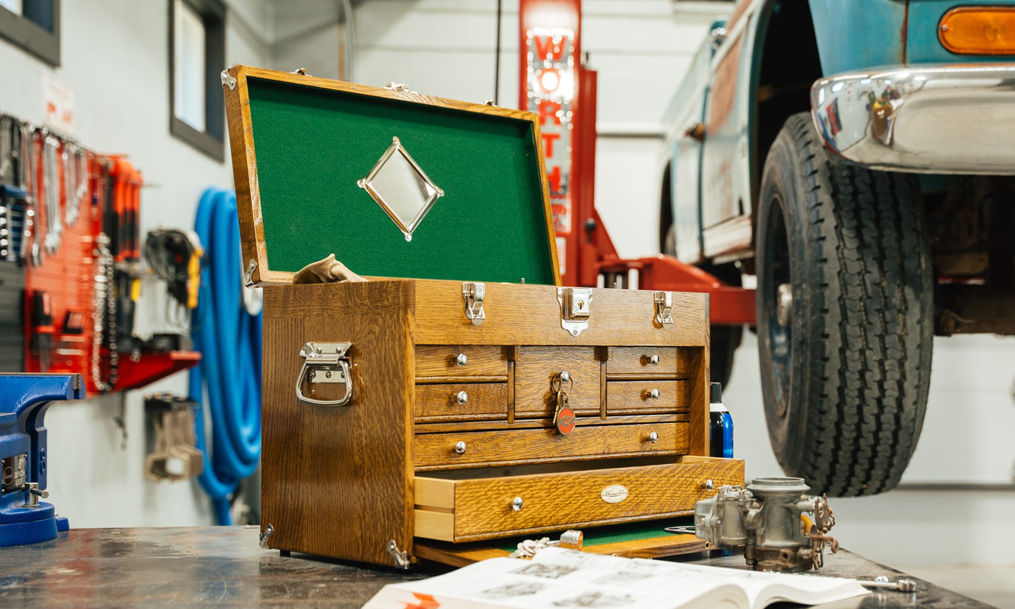 Wood tool chest on a bench in a mechanics garage