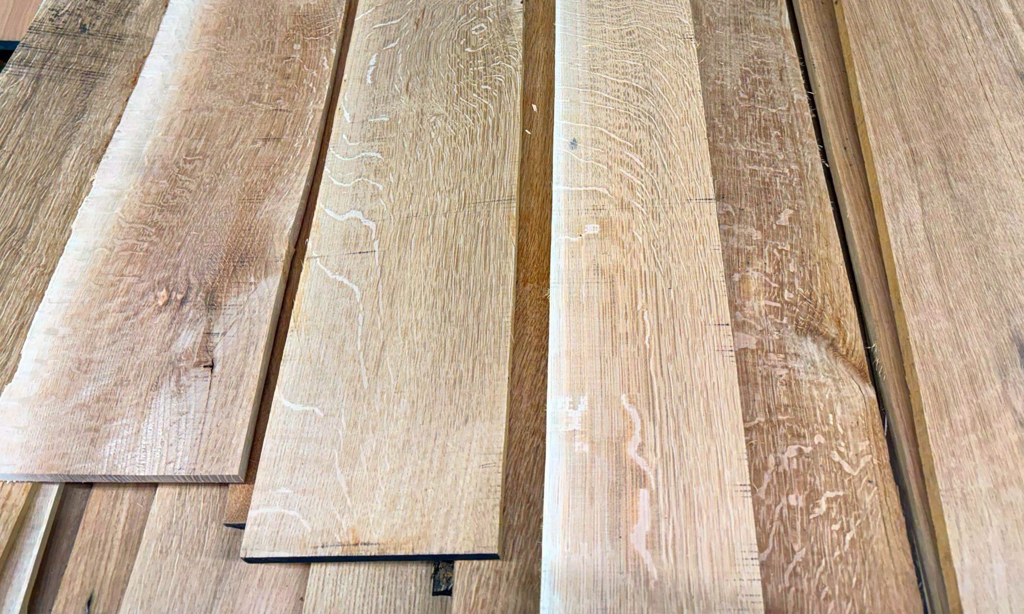 Stack of premium hardwood lumber used in Gerstner wood tool chest construction